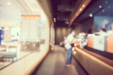 Abstract blur and defocus coffee shop cafe and restaurant interior for backgroundの写真素材