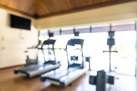 Abstract blur fitness equipment in gym interior room