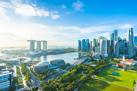 Beautiful architecture building exterior cityscape in Singapore city skyline with white cloud on blue skyのeditorial素材
