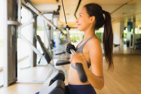 Portrait asian woman exercising workout and training in gym for healthy