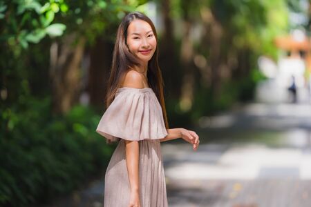 Portrait beautiful young asian woman smile happy in the gardenの写真素材