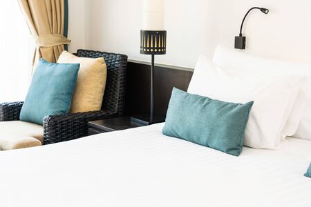 Beautiful luxury and comfortable bedroom interior decoration with white pillow blanket light lamp of...