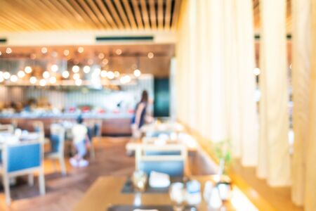 Abstract blur and defocused coffee shop cafe and buffet restaurant interior for backgroundの写真素材