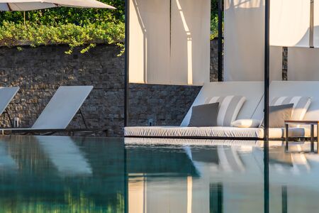 Outdoor swimming pool with umbrella chair lounge around there for leisure travel and vacation...
