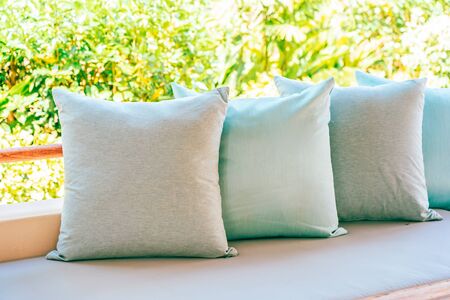 Pillow on sofa chair decoration outdoor patio with garden view for relax and leisureの写真素材