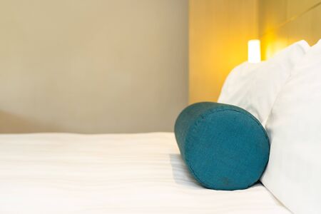Beautiful white pillow and blanket on bed decoration interior of bedroomの写真素材