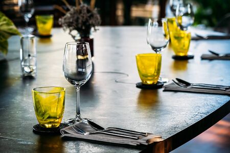 Wine glass with dining set prepare for breakfast lunch or dinner on table in restaurant and cafeの写真素材