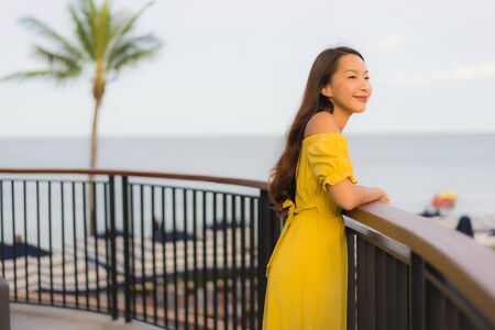 Portrait beautiful asian women happy smile relax on the tropical beach sea ocean in holiday vacationの写真素材