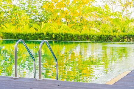 Beautiful luxury outdoor swimming pool in hotel and resort for holiday vacation travel concept