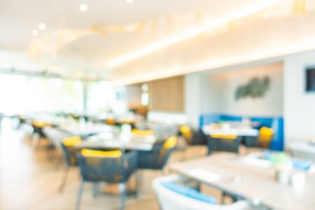 Abstract blur and defocused buffet restaurant and coffee shop cafe interior for backgroundの写真素材