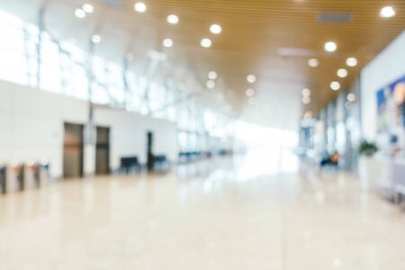 Abstract blur and defocused airport passenger terminal for transportation interior for backgroundの写真素材