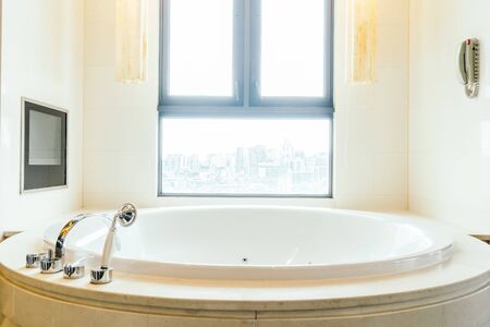 Beautiful luxury white bathtub decoration interior of bathroomの写真素材