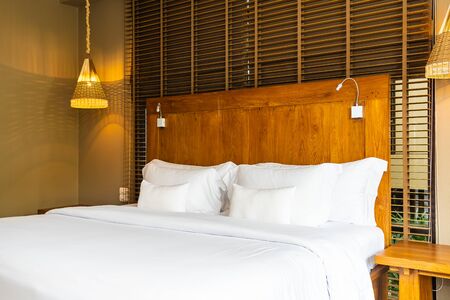 Beautiful luxury comfortable white pillow on bed and blanket decoration in bedroom interiorの写真素材