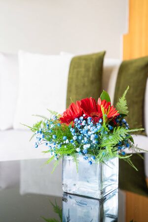 Vase flower on table with pillow on sofa decoration interior of living roomの写真素材