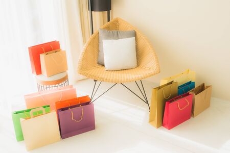 Empty chair decoration interior of living room with shopping bag around areaの写真素材