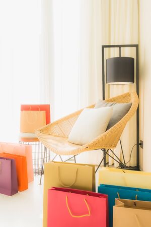 Empty chair decoration interior of living room with shopping bag around areaの写真素材