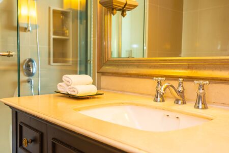 White sink with water faucet decoration in bathroom interiorの写真素材