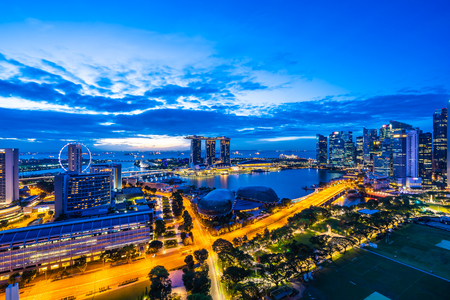 Beautiful architecture building exterior of singapore city skyline at twilight and night timeのeditorial素材
