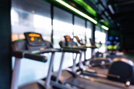 Abstract blur gym and fitness equipment interior of room for background