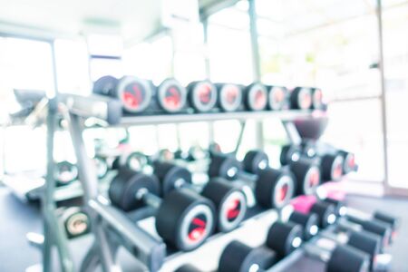 Abstract blur gym room interior with fitness equipment for backgroundの写真素材