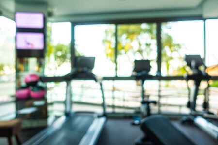 Abstract blur gym room interior with fitness equipment for backgroundの写真素材