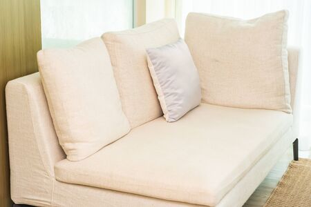 Comfortable pillow on sofa decoration with light lamp interior of living room area