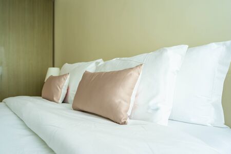 White comfortable pillow on bed decoration interior of bedroomの写真素材