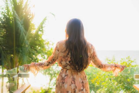 Portrait beautiful young asian women happy smile around outdoorn happy smile relax around tropical nature beach sea with palm treeの写真素材