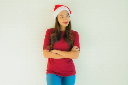 Portrait beautiful young asian women wearing santa hat for celebration in christmas anniversary dayの写真素材