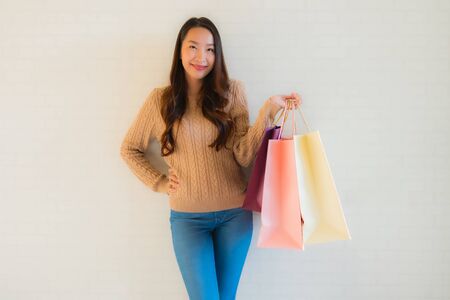 Portrait beautiful young asian women happy smile with shopping bag and coffee cupの写真素材