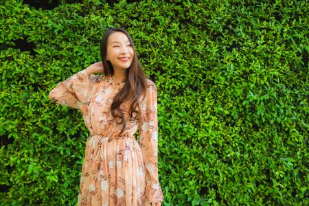 Portrait beautiful young asian women happy smile around outdoor viewの写真素材