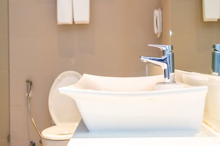 Water facuet and white sink decoration interior of bathroom and toiletの写真素材