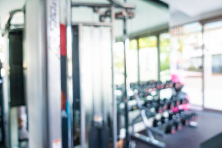Abstract blur gym room interior with fitness equipment for backgroundの写真素材