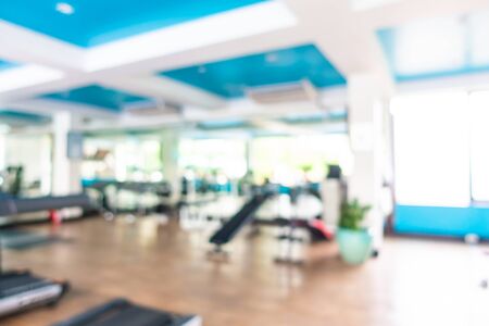 Abstract blur gym room interior with fitness equipment for backgroundの写真素材