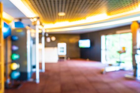 Abstract blur defocus fitness equipment in gym room interior for backgroundの写真素材