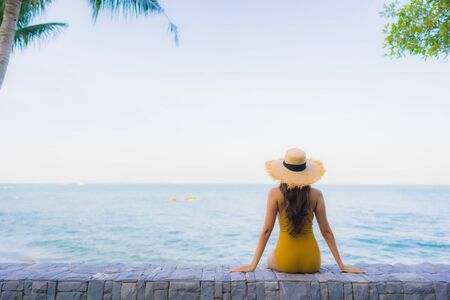 Portrait beautiful young asian women happy relax smile around sea beach ocean for travel vacation in holidayの写真素材