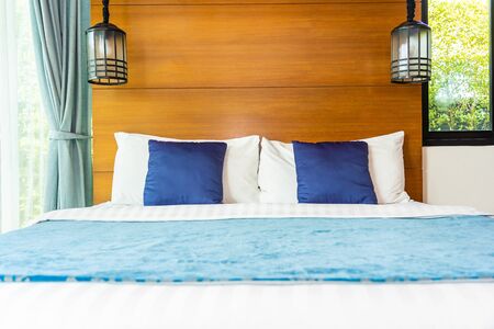 Pillow on bed decoration interior of bedroom interior with light lampの写真素材