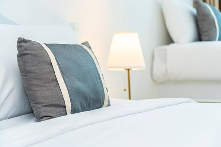 Pillow on bed decoration interior of bedroom interior with light lampの写真素材