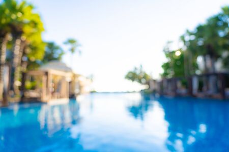 Abstract blur and defocus outdoor swimming pool in hotel resort for travel and vacation backgroundの写真素材