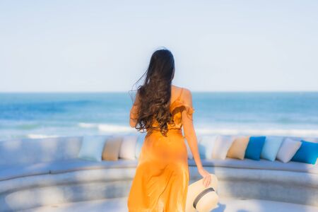 Portrait beautiful young asian woman happy smile around sea ocean beach and blue sky for leisure travel vacationの写真素材