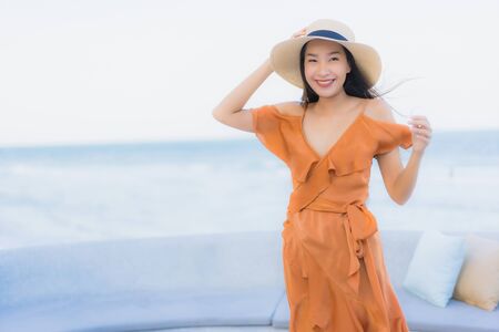 Portrait beautiful young asian woman happy smile around sea ocean beach and blue sky for leisure travel vacationの写真素材