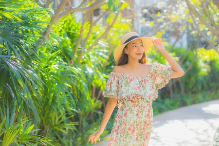 Portrait beautiful young asian woman walking with happy enjoy around outdoor garden viewの写真素材
