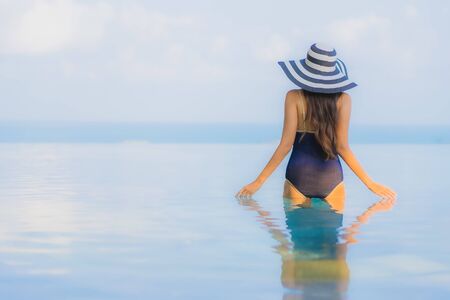 Portrait beautiful young asian woman relax around swimming pool in hotel resort for leisure in...