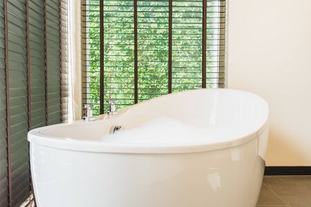 Beautiful luxury white bathtub decoration interior of bathroom for spa