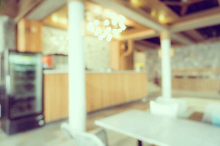 Abstract blur and defocus coffee shop cafe and restaurant interior for backgroundの写真素材