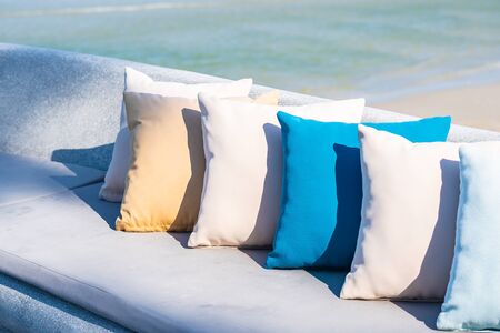 Pillow on chair or sofa lounge around outdoor patio with sea ocean beach view for travelの写真素材
