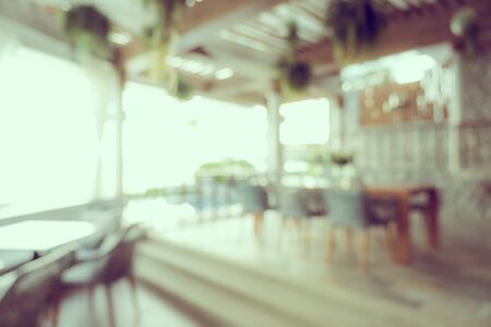 Abstract blur and defocus coffee shop cafe and restaurant interior for backgroundの写真素材