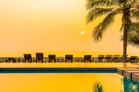 Beautiful nature with palm tree around outdoor swimming pool in hotel resort nearly sea ocean beachの写真素材