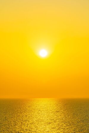 Beautiful sunset or sunrise around sea ocean bay with cloud on sky for leisure vacationの写真素材