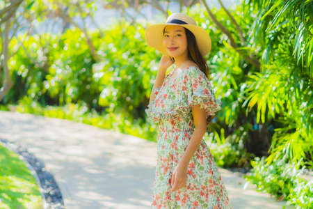 Portrait beautiful young asian woman walking with happy enjoy around outdoor garden viewの写真素材